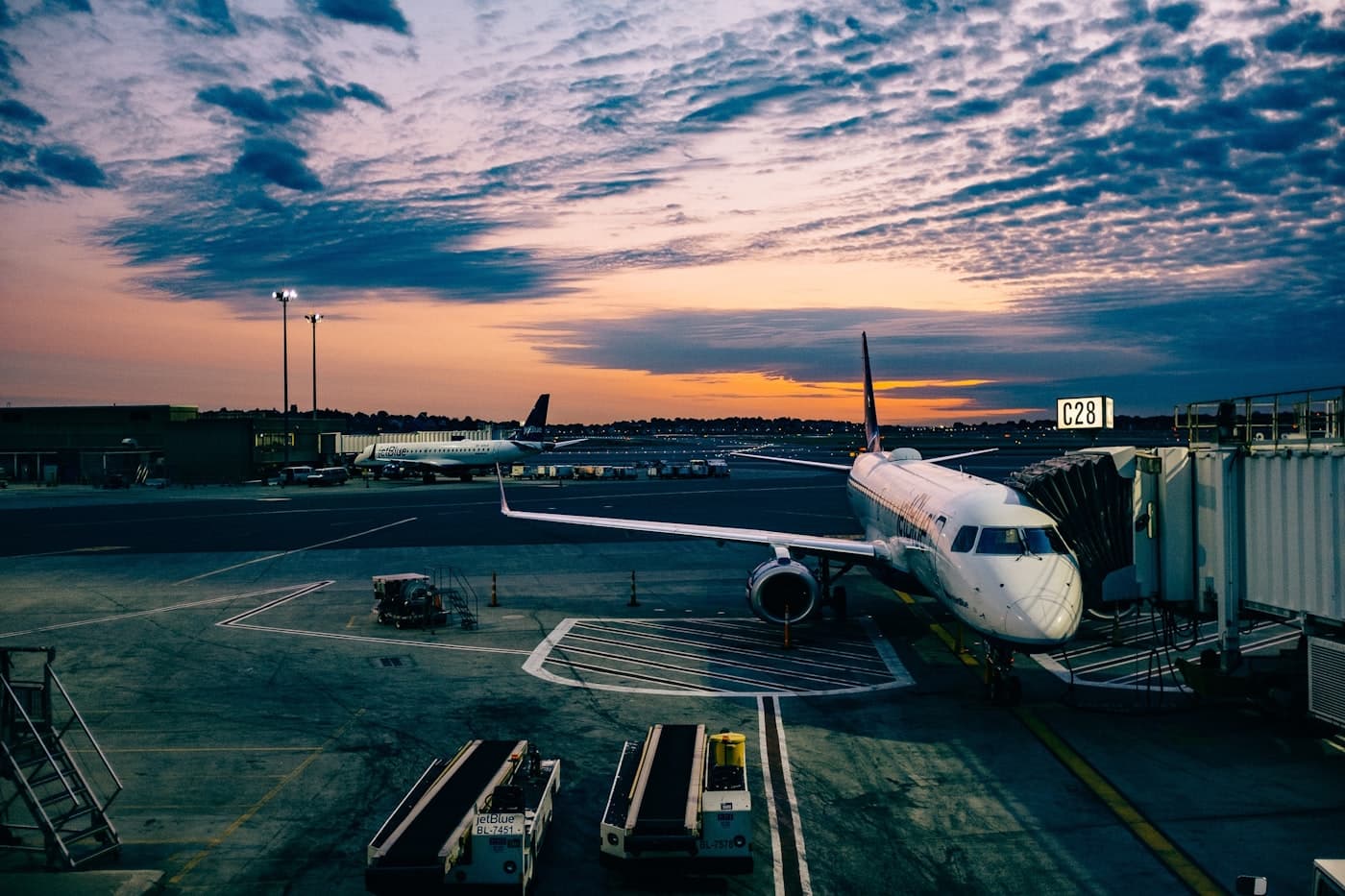Aircraft silhouette against sunset clouds